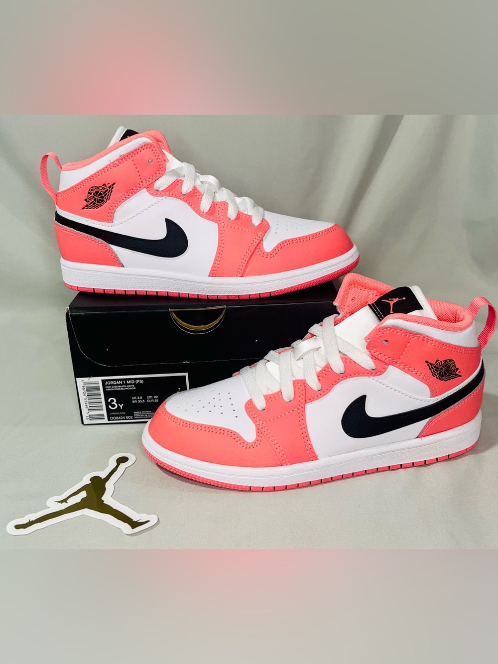 Nike Kids Pink and White High-Top Sneakers with Black Swoosh